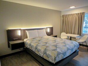 Desk, laptop workspace, blackout curtains, iron/ironing board