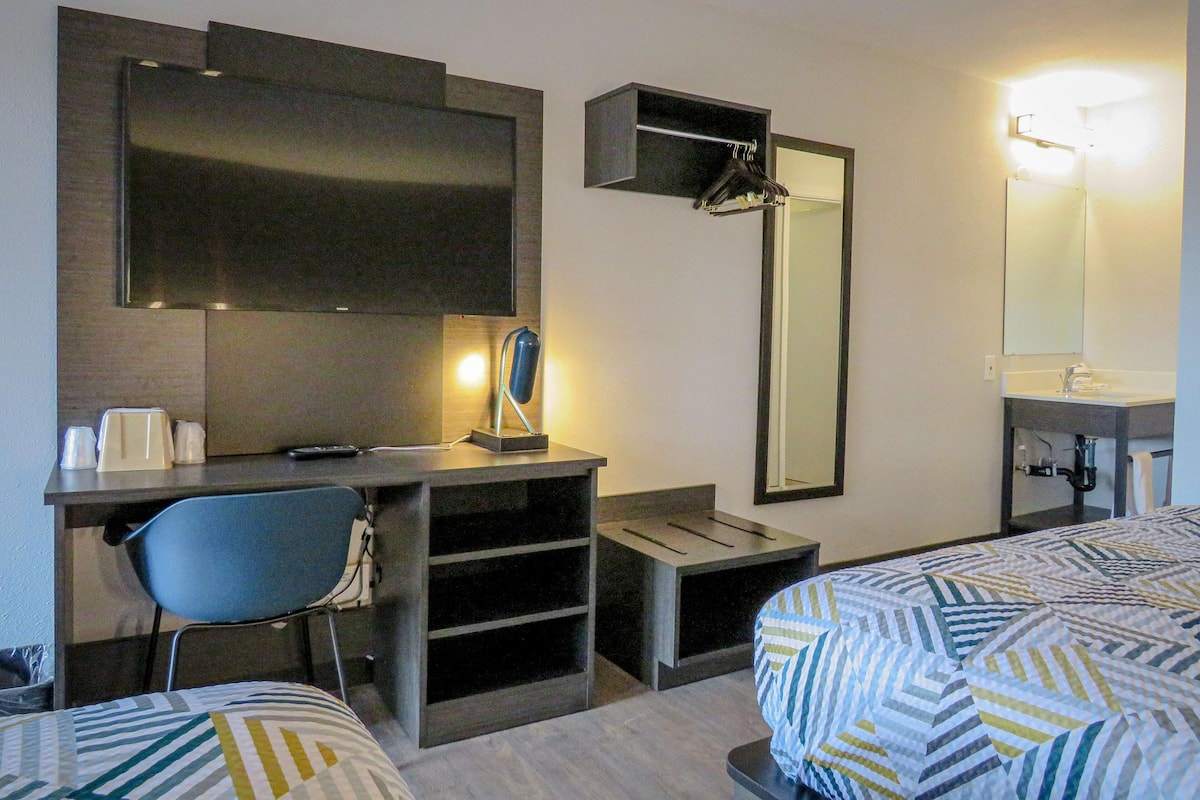 Desk, laptop workspace, blackout curtains, iron/ironing board