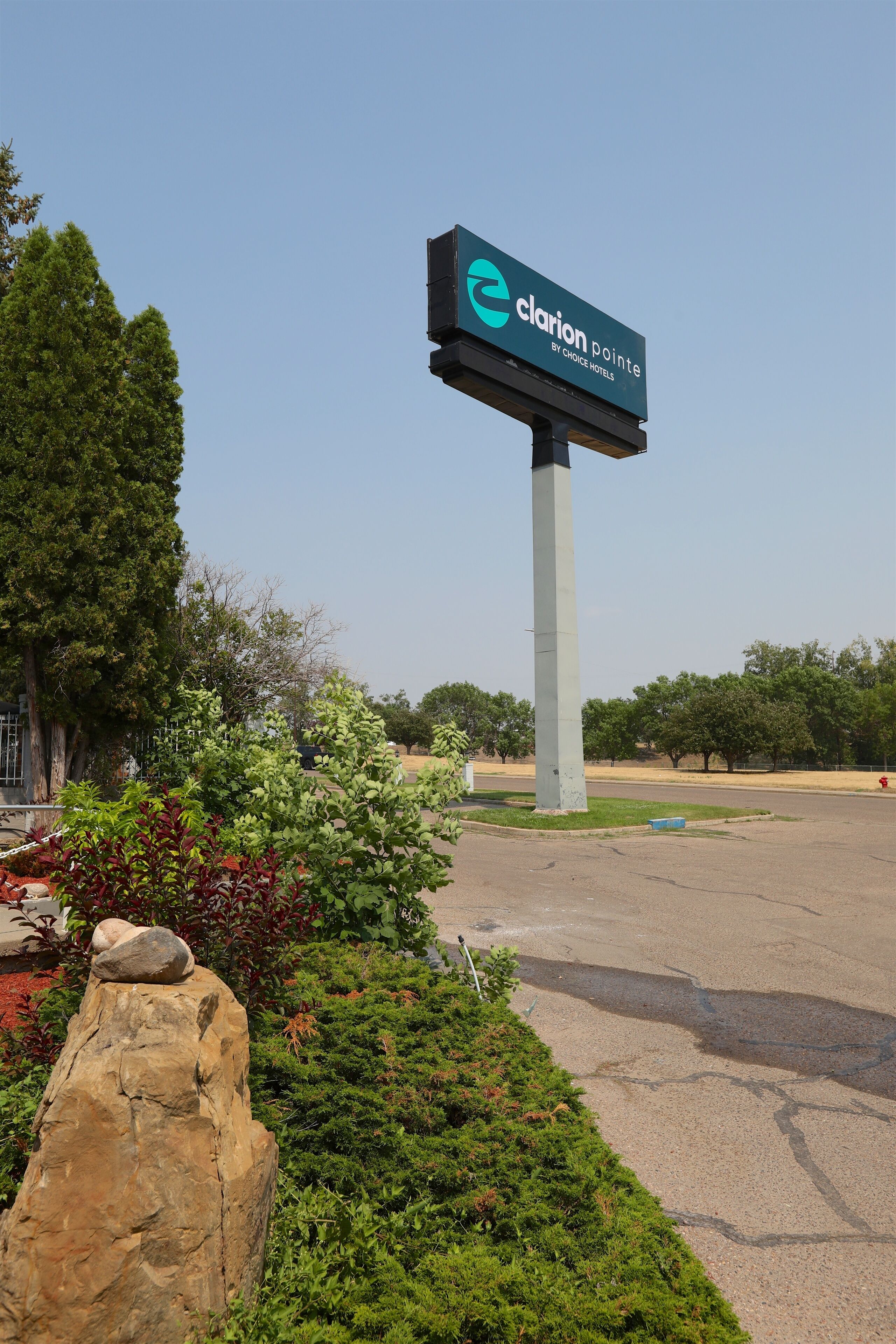A hotel sign with the name 'Clarion Pointe by Choice Hotels'.