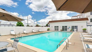 Seasonal outdoor pool, open 8:00 AM to 8:00 PM, pool umbrellas
