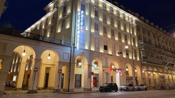 A multi-story hotel with a classic architectural style, featuring arched windows and a prominent entrance. - Hotel Diplomatic (Turin)