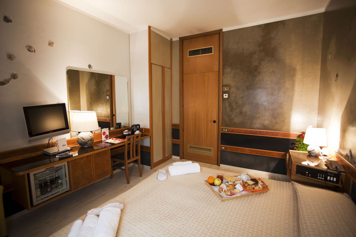 Premium bedding, down comforters, Select Comfort beds, minibar