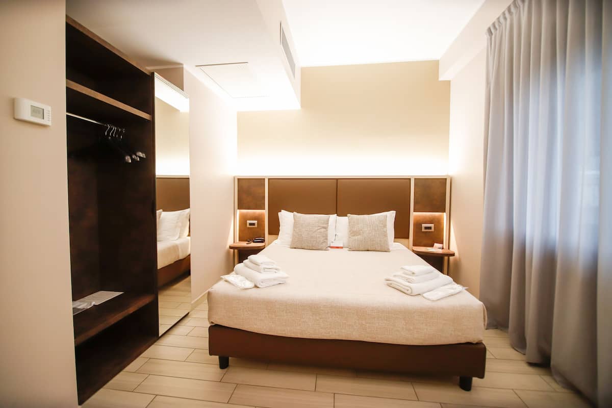 Premium bedding, down comforters, Select Comfort beds, minibar