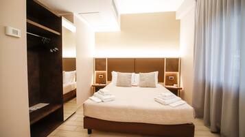 Luxe beddengoed, donzen dekbedden, Select Comfort-bedden, een minibar