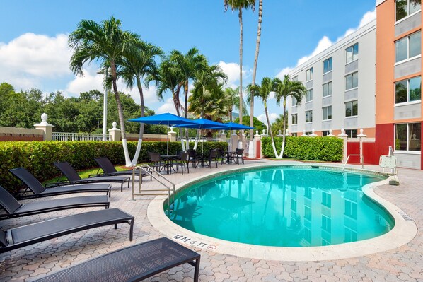 Outdoor pool, open 7:00 AM to 10:00 PM, pool umbrellas, pool loungers