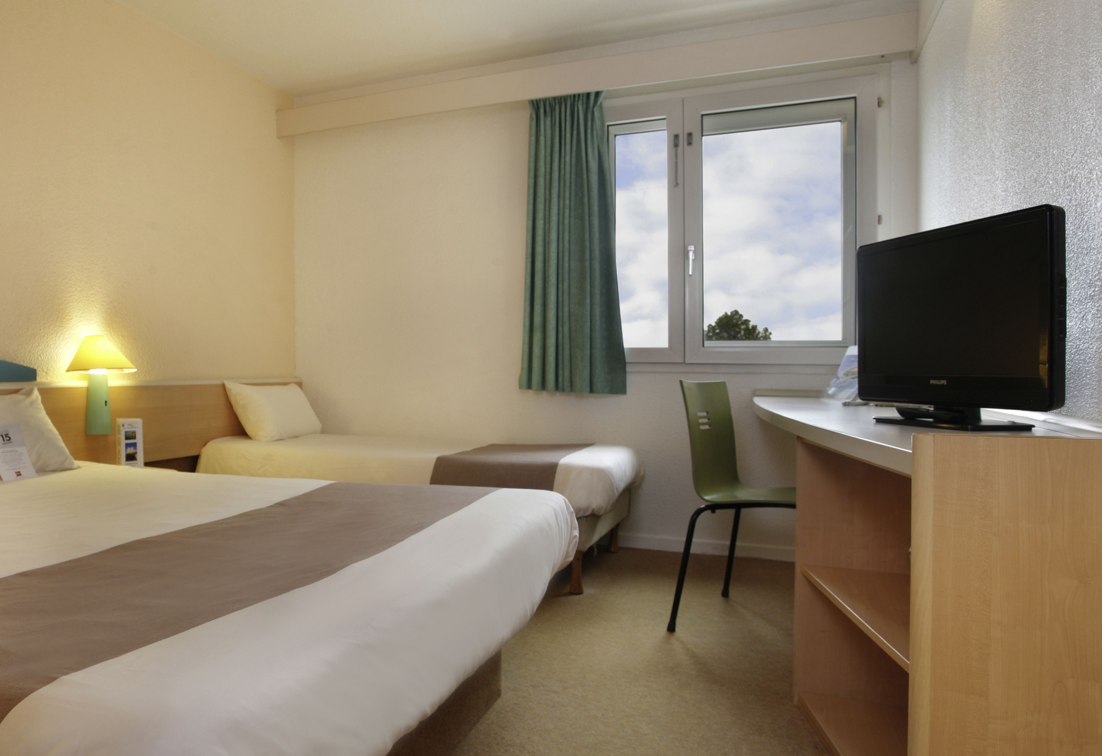 standard double room, multiple beds | in-room safe, individually decorated, individually furnished, desk