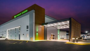 A modern building with a sign reading "Wyndham Garden." - Wyndham Garden Ankeny/Des Moines (Ankeny)