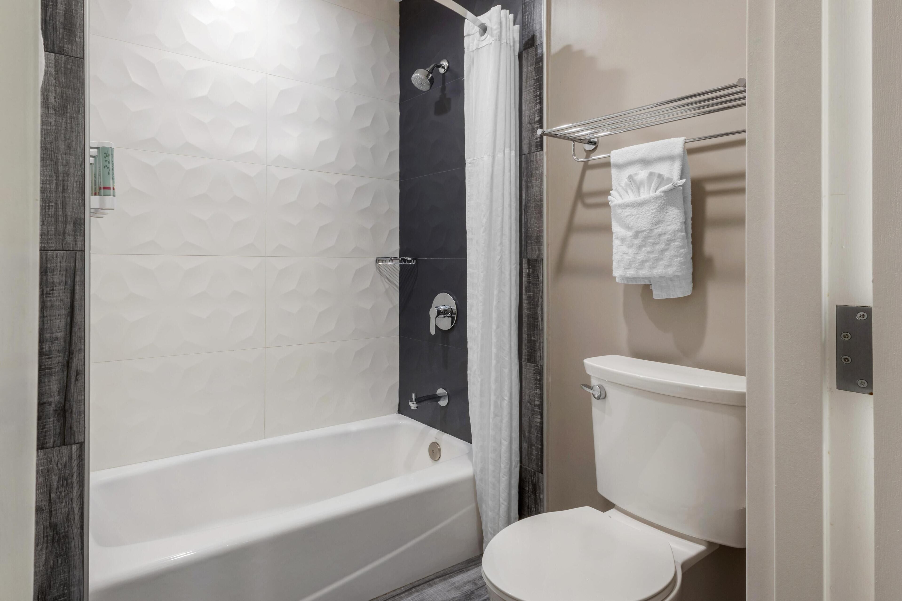 standard room, 2 queen beds, non smoking, refrigerator & microwave | bathroom | hydromassage showerhead, free toiletries, hair dryer, towels