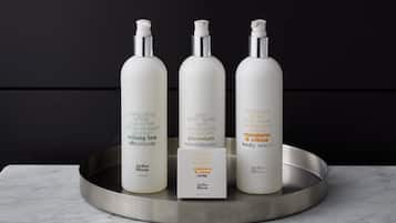Three bottles of skincare products on a tray.