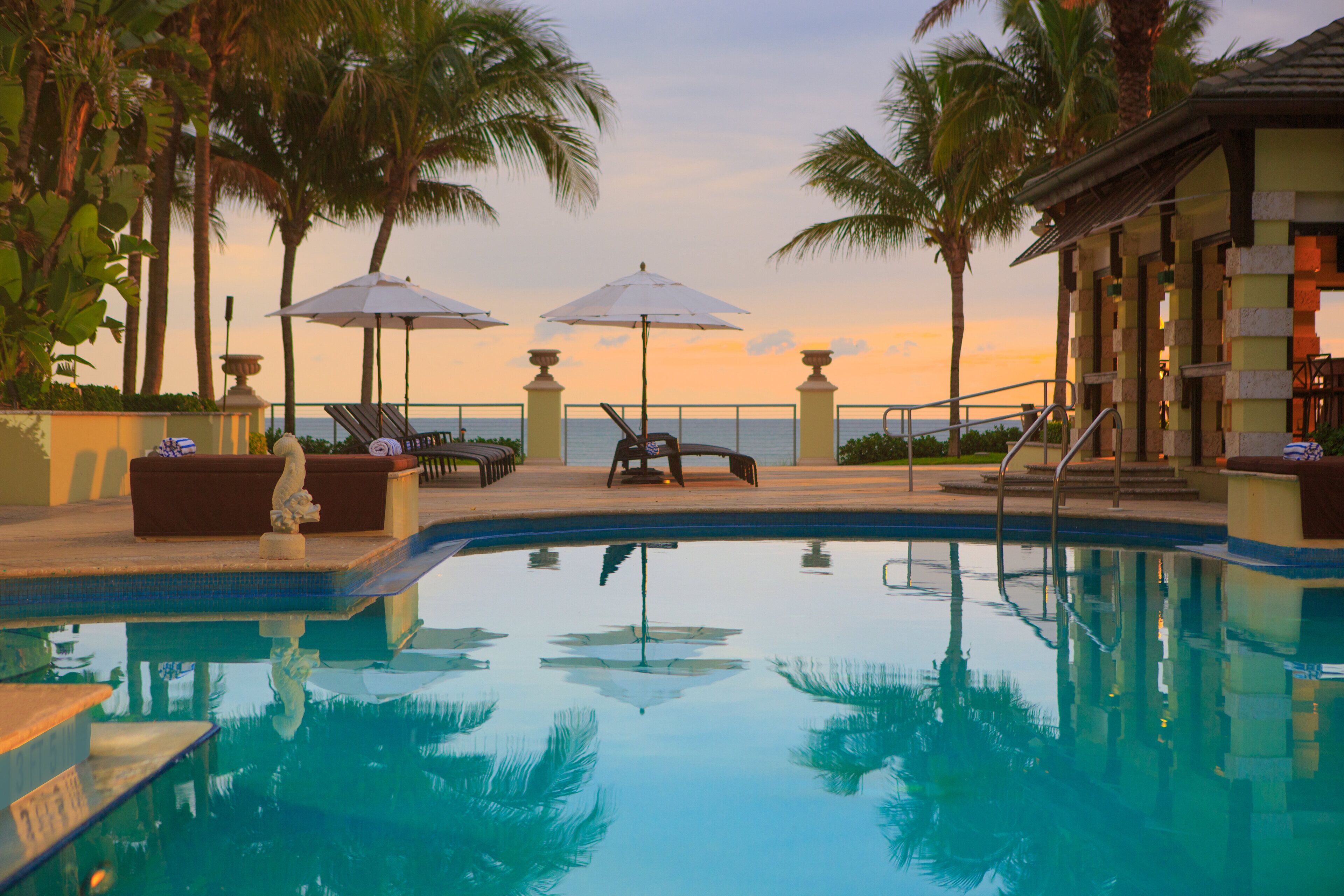 Outdoor pool, open 6:00 AM to 8:00 PM, pool umbrellas, sun loungers