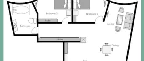 A floor plan of a hotel room with two bedrooms, a bathroom, a robe, a dining area, a kitchen, and an entryway.