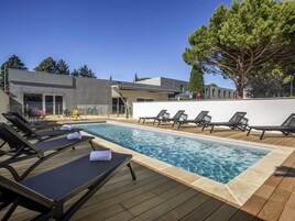 Seasonal outdoor pool, open 9:00 AM to 9:00 PM, sun loungers