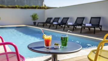 Seasonal outdoor pool, open 9:00 AM to 9:00 PM, sun loungers