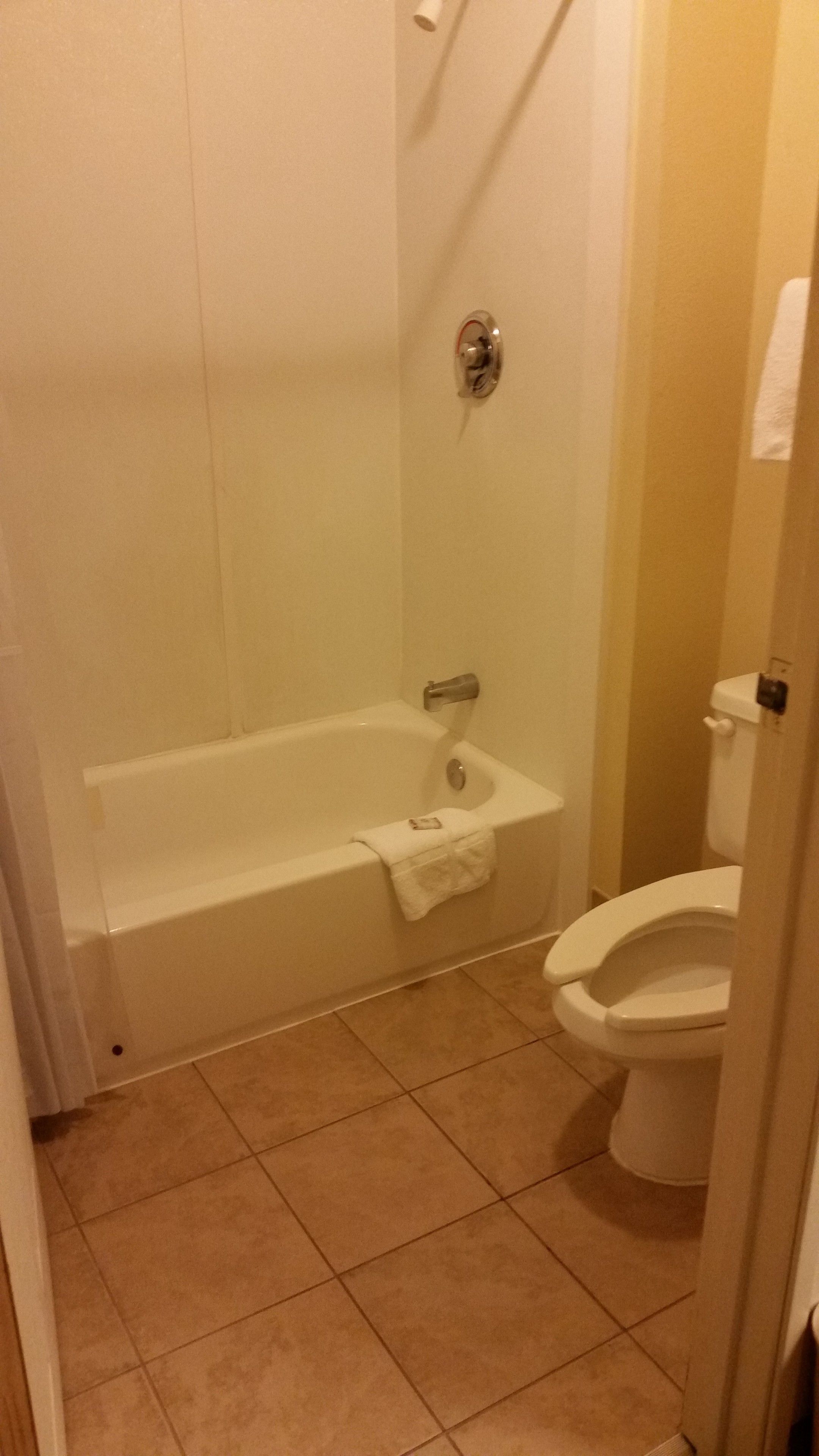 A bathroom with a bathtub, a sink, and a toilet.