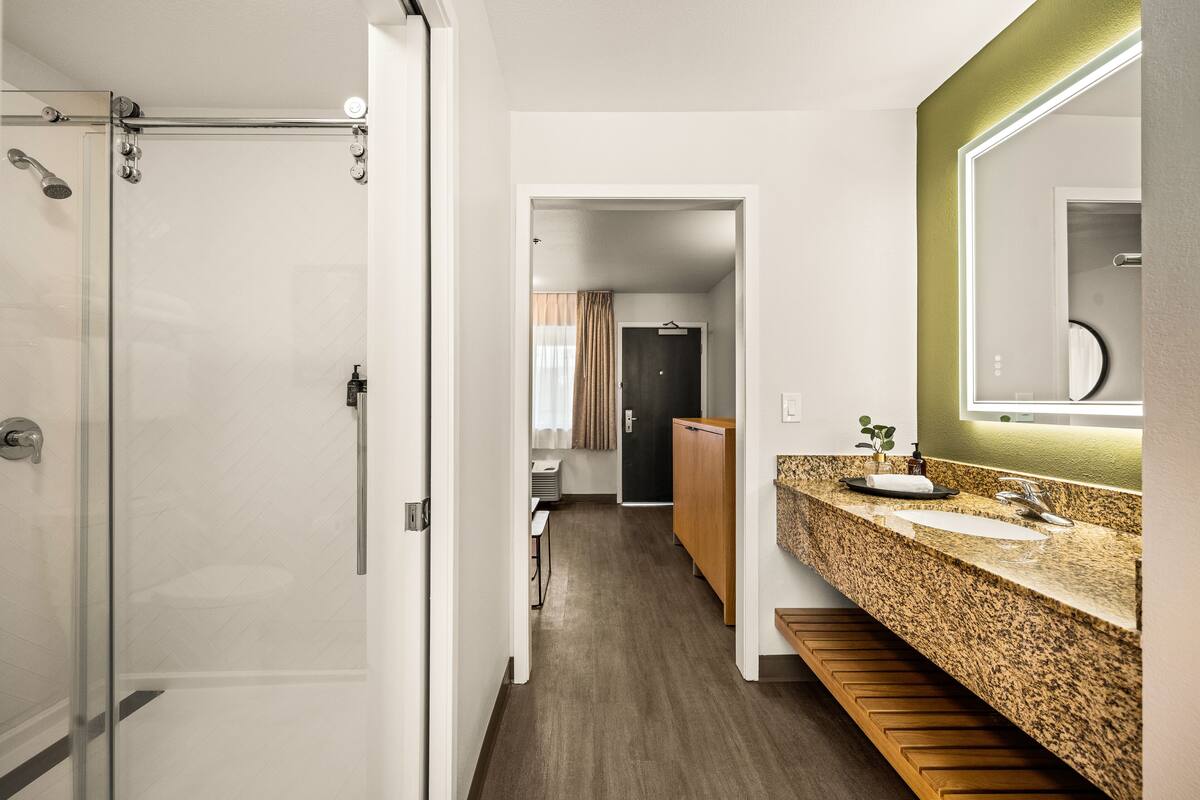 deluxe king suite sleeper sofa | bathroom | free toiletries, hair dryer, towels