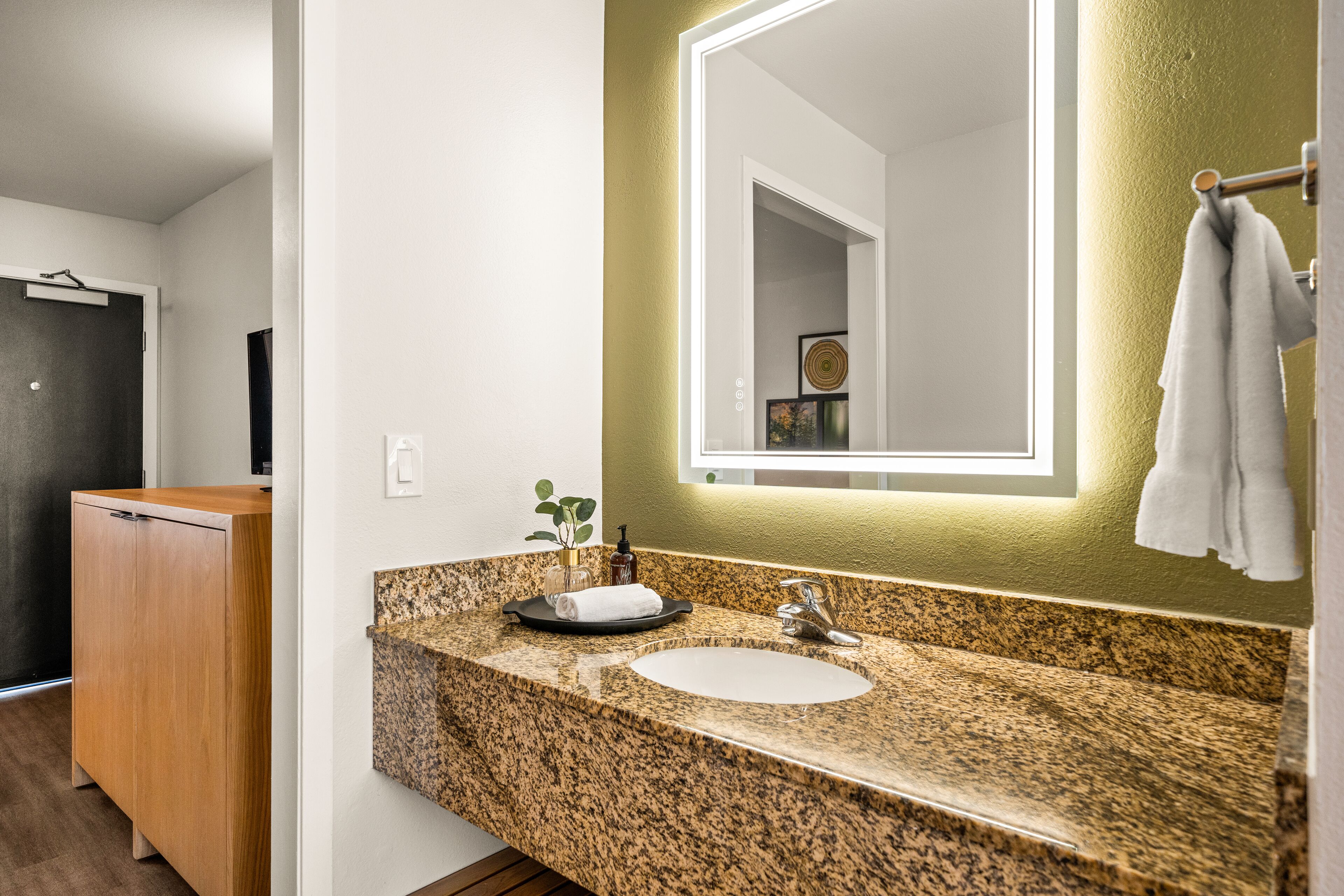 deluxe king suite sleeper sofa | bathroom | free toiletries, hair dryer, towels