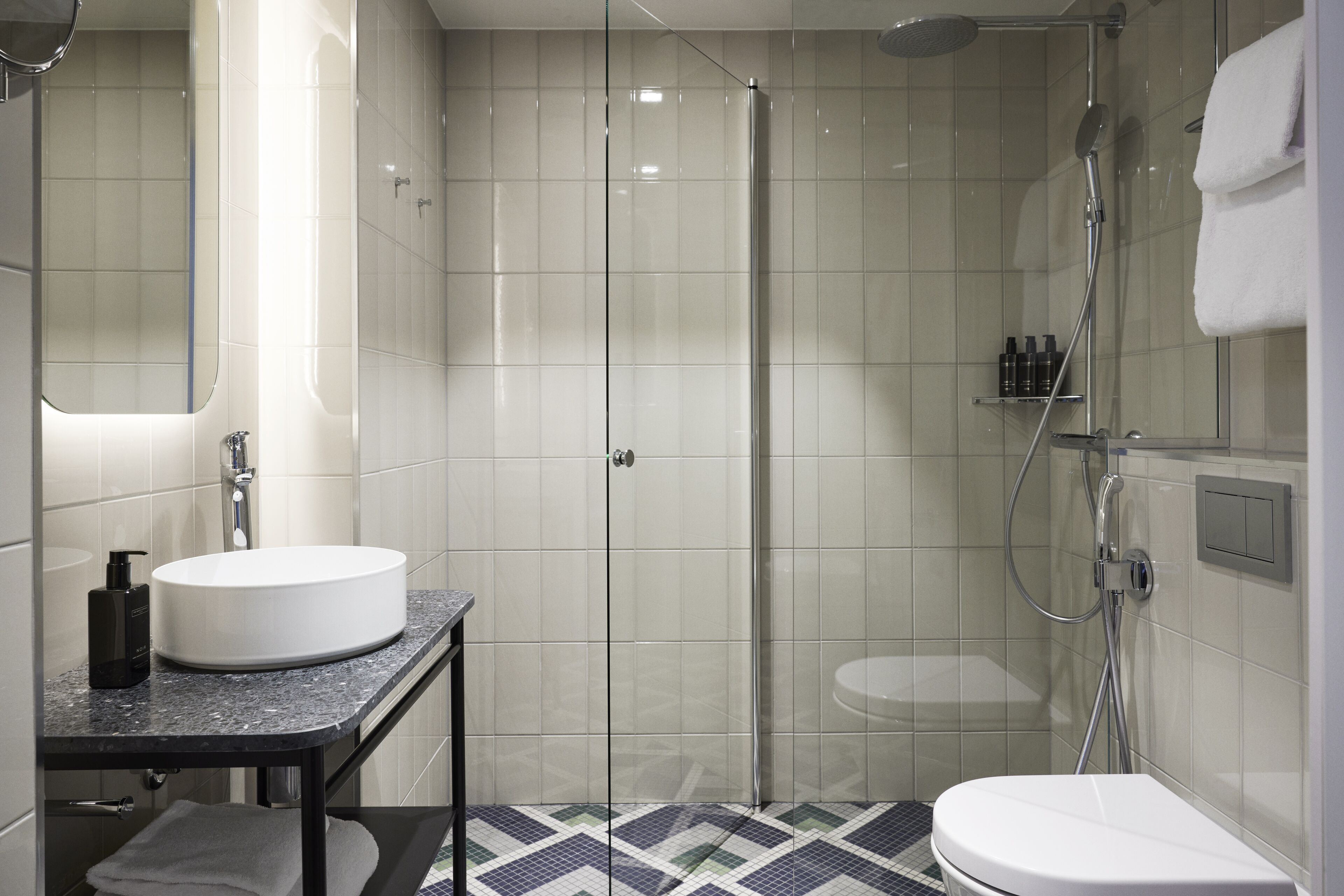 shower, hair dryer, bidet, towels