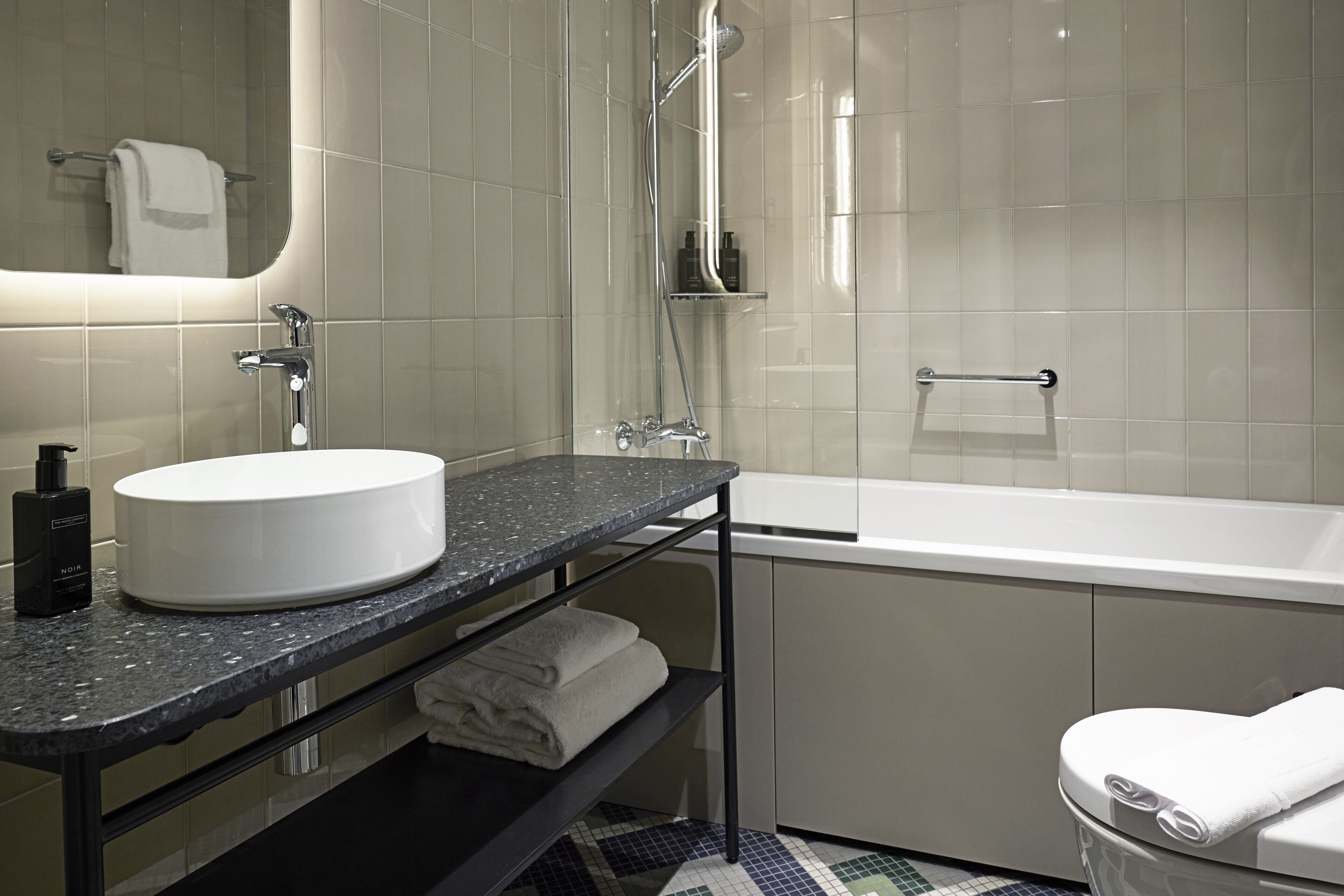 art deco suite | bathroom | shower, hair dryer, bidet, towels