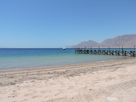 Private beach, beach umbrellas, beach towels, beach massages