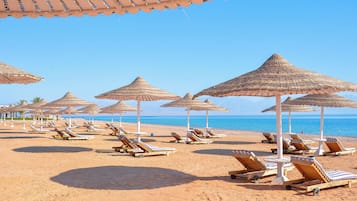 Private beach, beach umbrellas, beach towels, beach massages