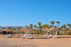 Private beach, beach umbrellas, beach towels, beach massages