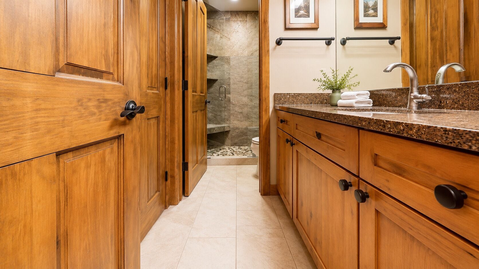 A wooden kitchen with a granite countertop, a sink, and a stone backsplash.