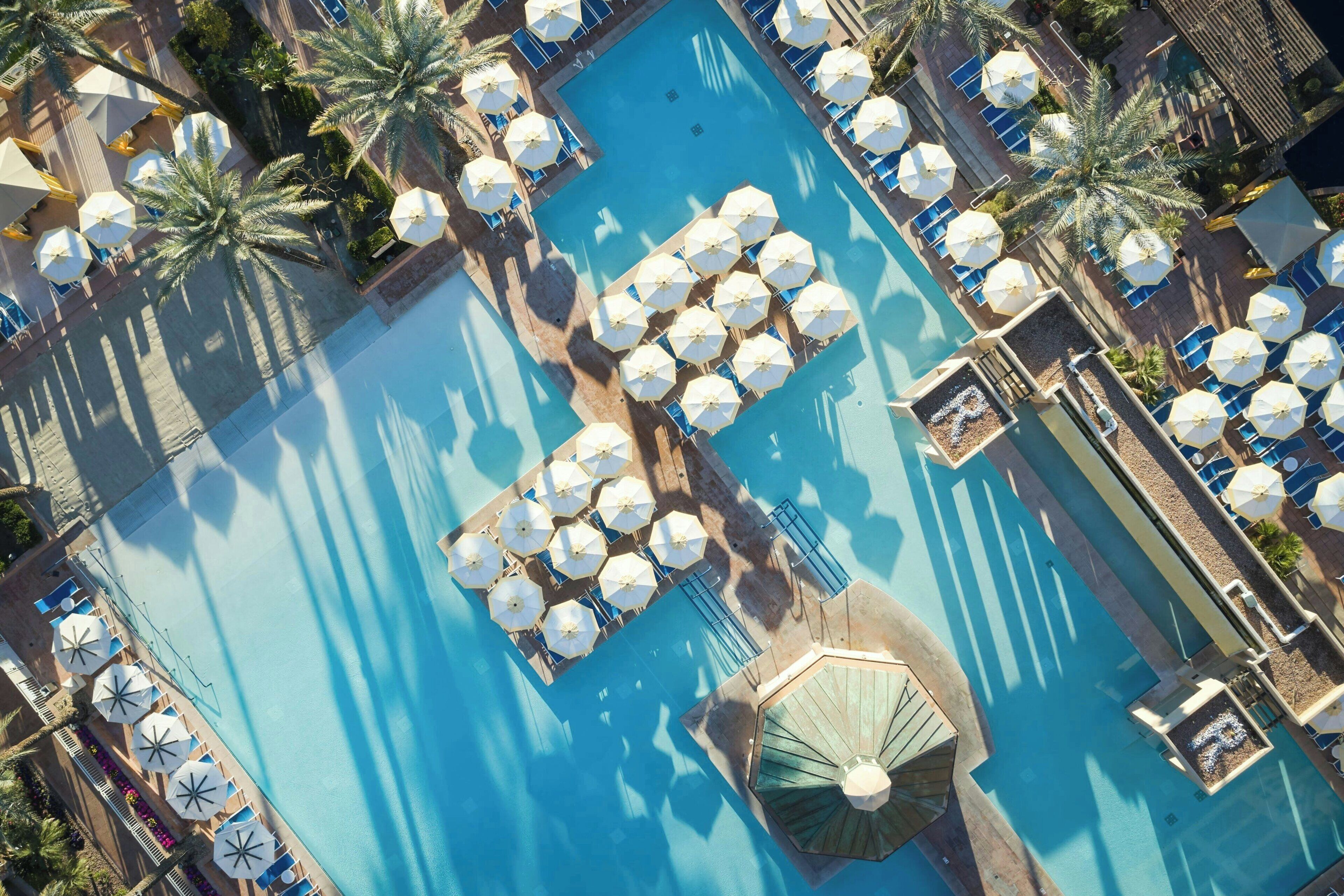 Outdoor pool, open 8:00 AM to 10:00 PM, cabanas (surcharge)