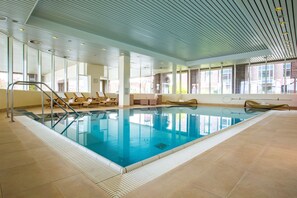 Indoor pool, open 6:00 AM to 10:00 PM, pool loungers