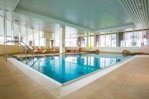 Indoor pool, open 6:00 AM to 10:00 PM, pool loungers