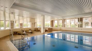 Indoor pool, open 6:00 AM to 10:00 PM, pool loungers