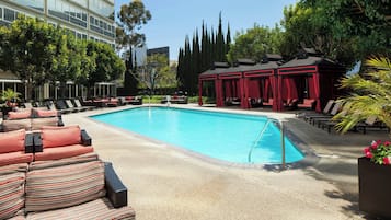 Outdoor pool, a heated pool, open 6:00 AM to 10:00 PM, free cabanas