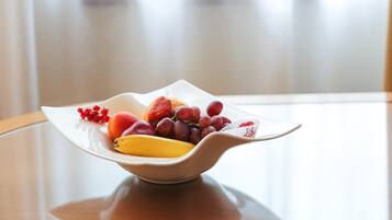 A fruit bowl on a table with a blurred background.