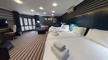 Family Room, 2 Double Beds | Desk, laptop workspace, blackout drapes, iron/ironing board