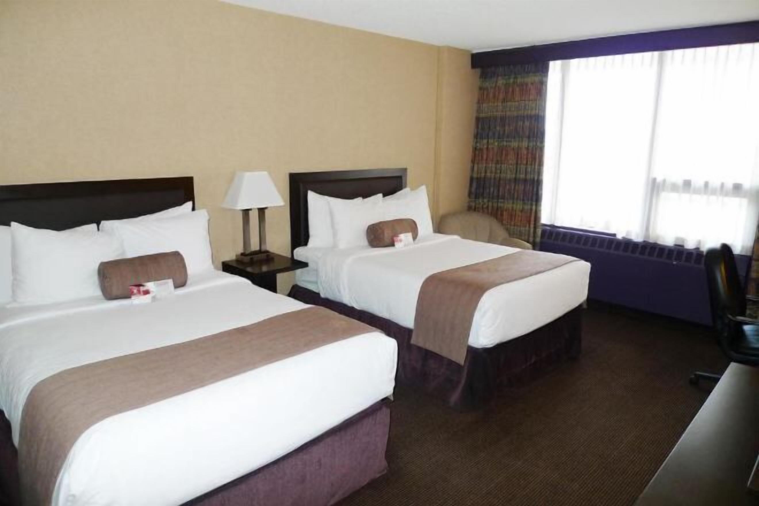 Desk, blackout drapes, iron/ironing board, free cribs/infant beds