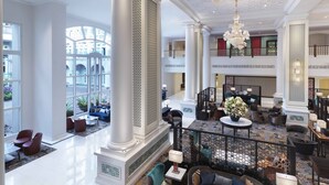 A spacious lobby with high ceilings, large windows, and a grand chandelier. - Frasers House, a Luxury Collection Hotel, Singapore (Singapore)