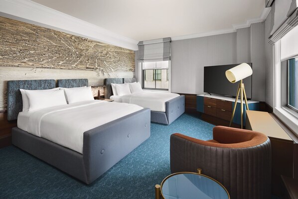 Ropa de cama de alta calidad y caja de seguridad en la habitación 