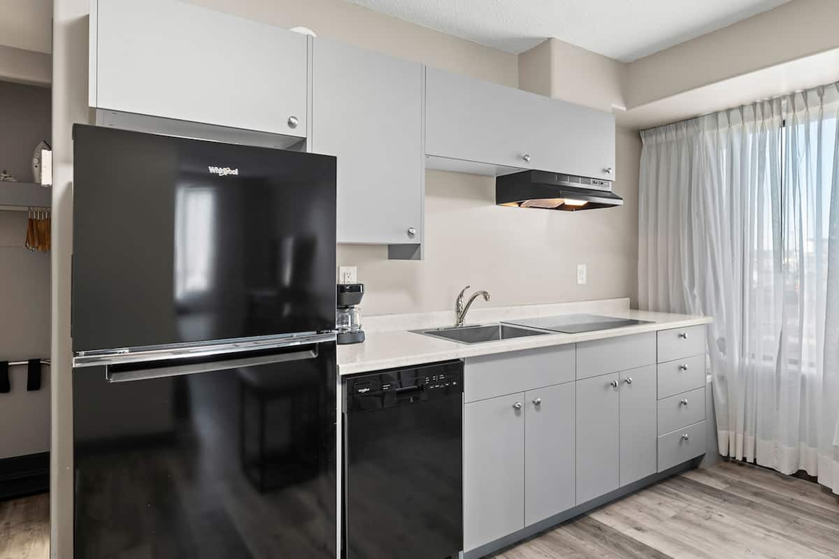 suite, 1 king bed, non smoking, kitchenette | private kitchen | fridge, microwave, coffee/tea maker, high chair