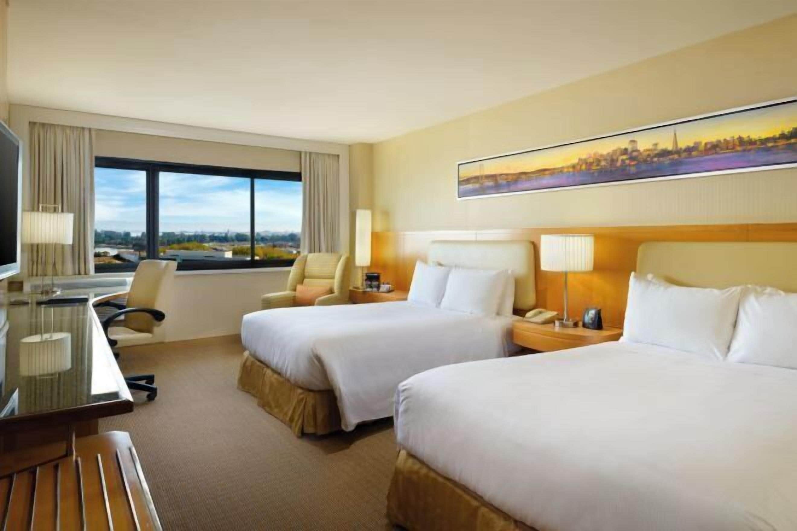 Premium bedding, pillow-top beds, in-room safe, desk