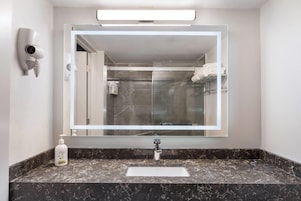 Room, 1 King Bed, Non Smoking | Bathroom | Combined shower/tub, free toiletries, hair dryer, towels