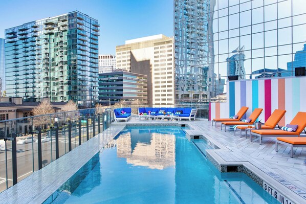 Outdoor pool, open 7:00 AM to 9:00 PM, pool umbrellas, sun loungers