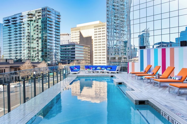 Outdoor pool, open 7:00 AM to 9:00 PM, pool umbrellas, sun loungers