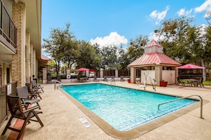 Seasonal outdoor pool, pool umbrellas, pool loungers