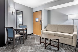 Hypo-allergenic bedding, desk, laptop workspace, blackout curtains