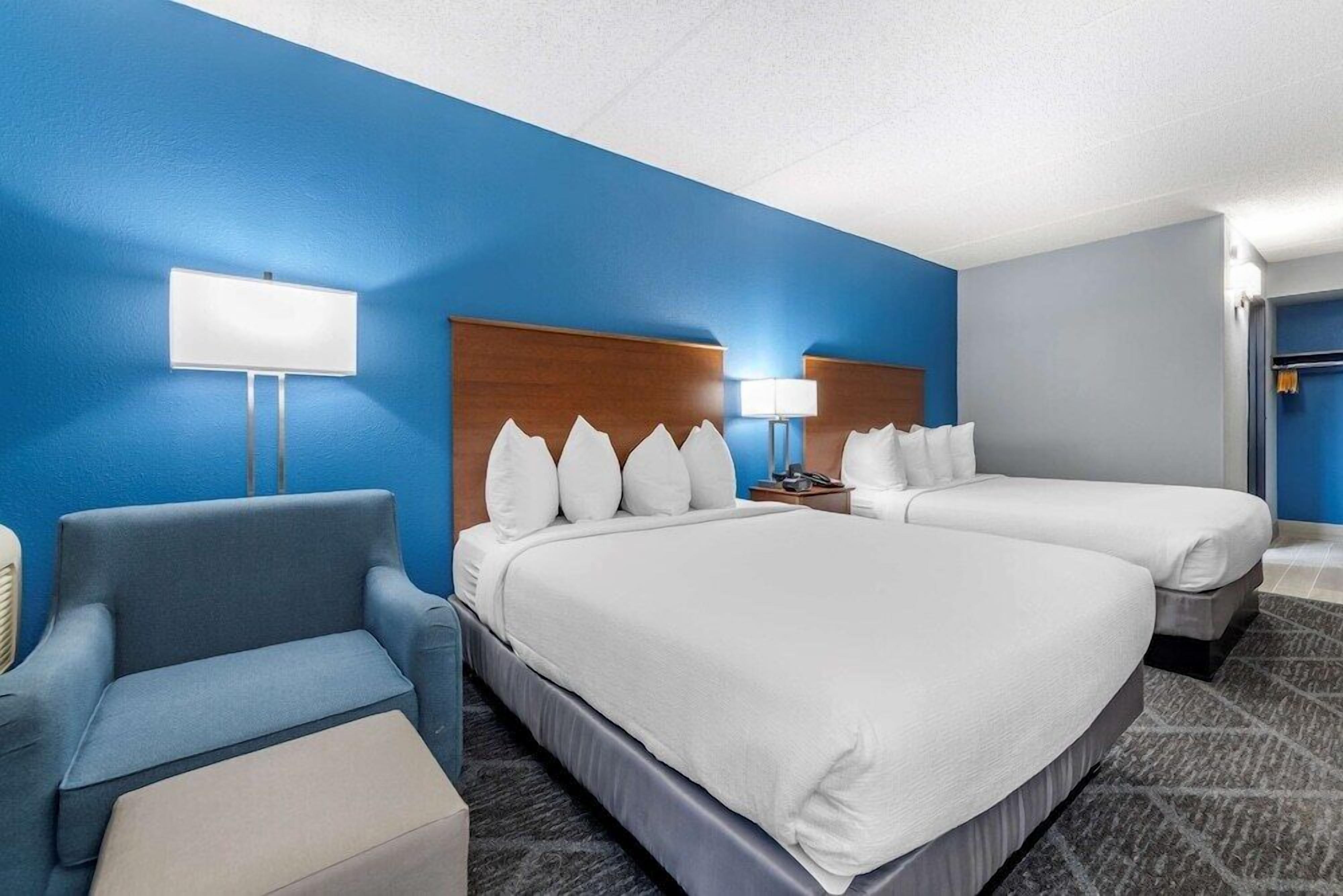 Hypo-allergenic bedding, desk, laptop workspace, blackout curtains
