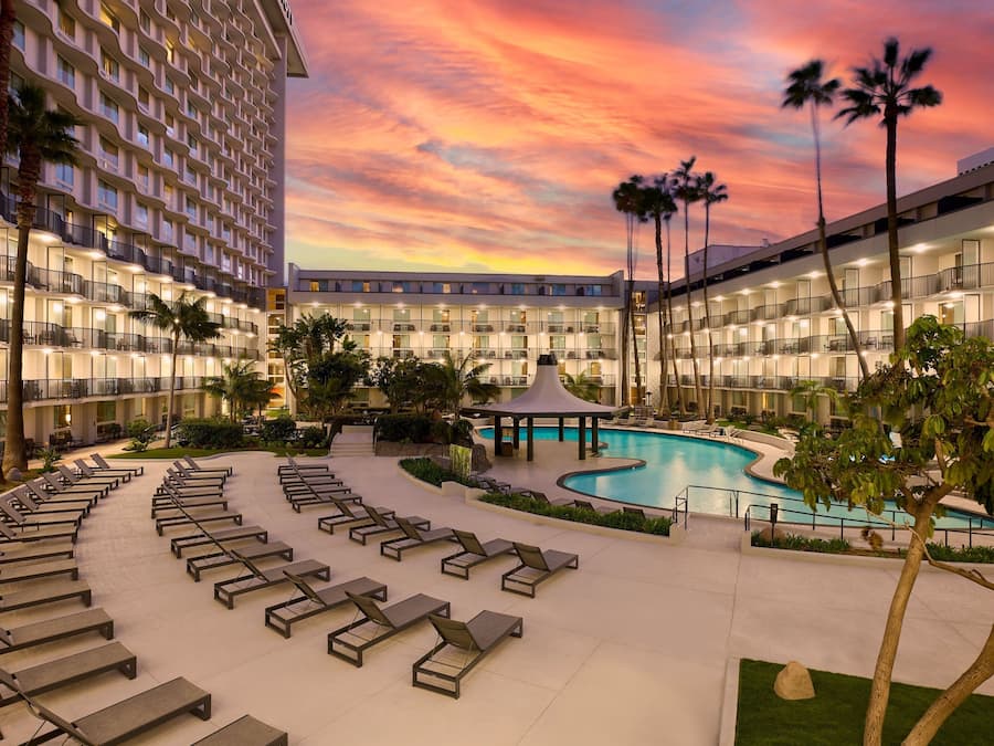 Outdoor pool, open 8 AM to 10 PM, pool loungers