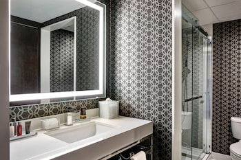 Combined shower/tub, designer toiletries, hair dryer, towels at Los Angeles Airport Marriott