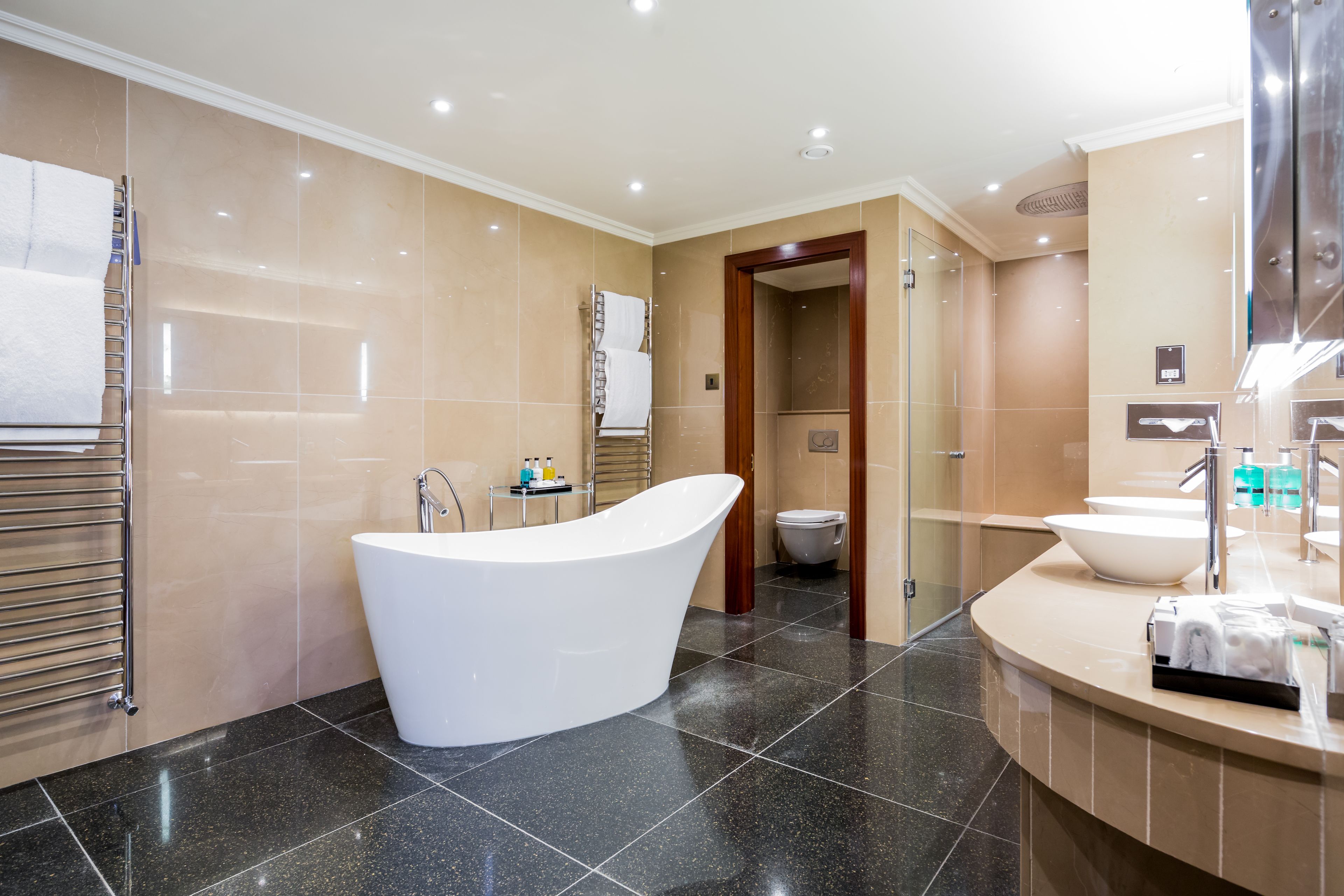 shower, designer toiletries, hair dryer, towels