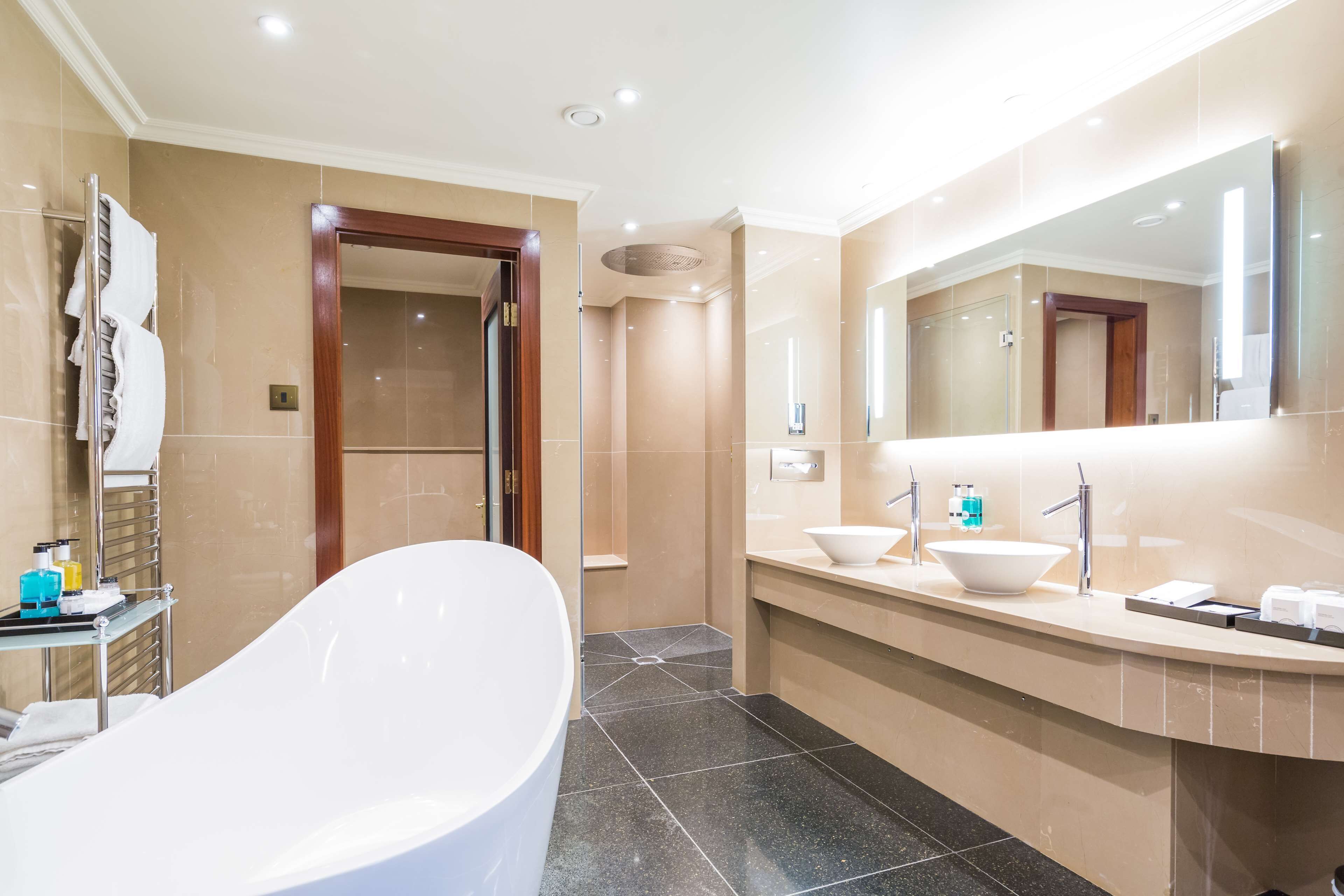 shower, designer toiletries, hair dryer, towels