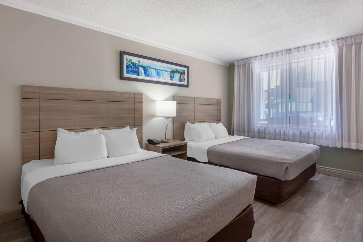 Exterior Room, 2 Queen Beds, Non Smoking | Premium bedding, desk, iron/ironing board, cribs (free)