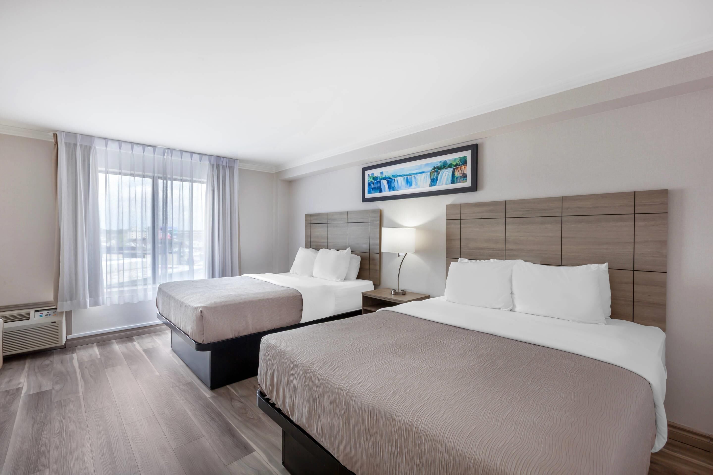 Room, 2 Queen Beds, Non Smoking | Premium bedding, desk, iron/ironing board, free cribs/infant beds